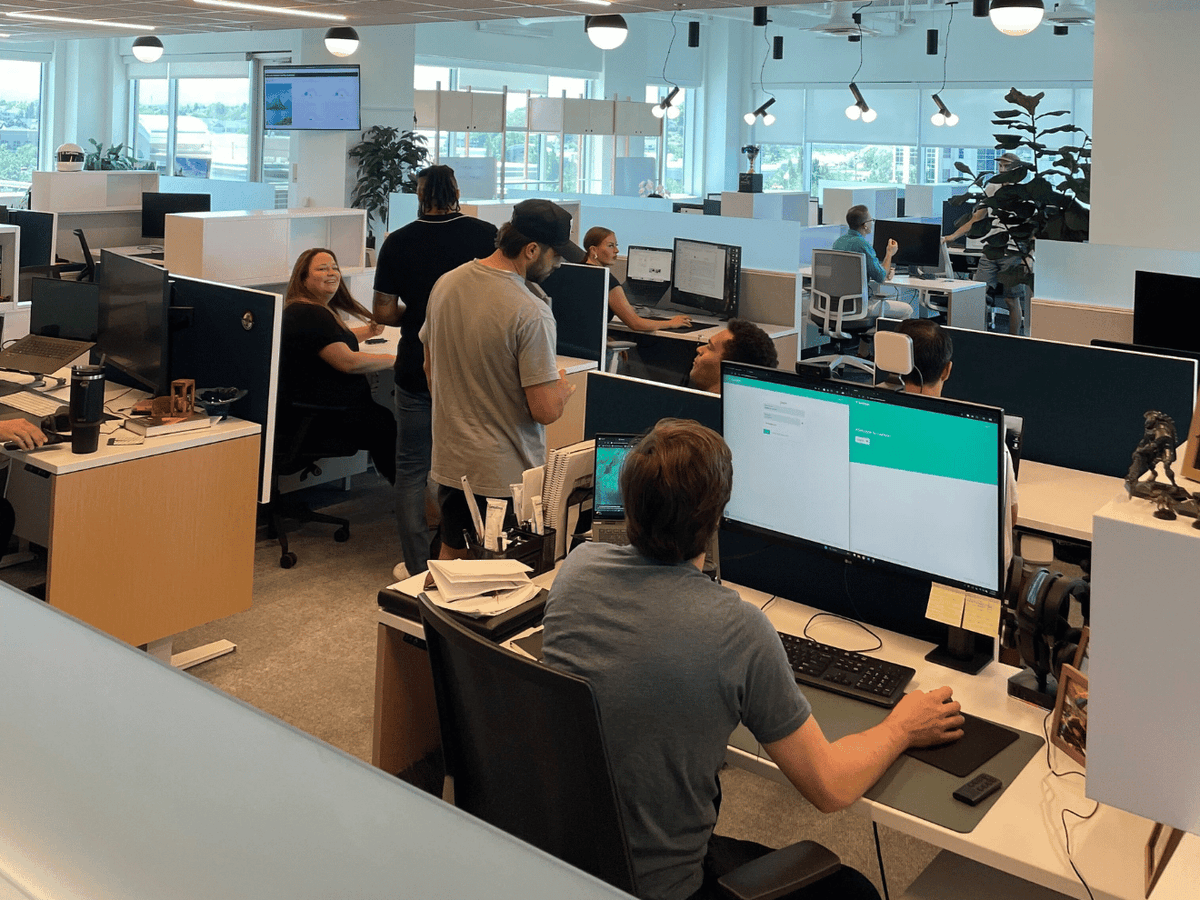 Lumion team collaborating in modern office workspace