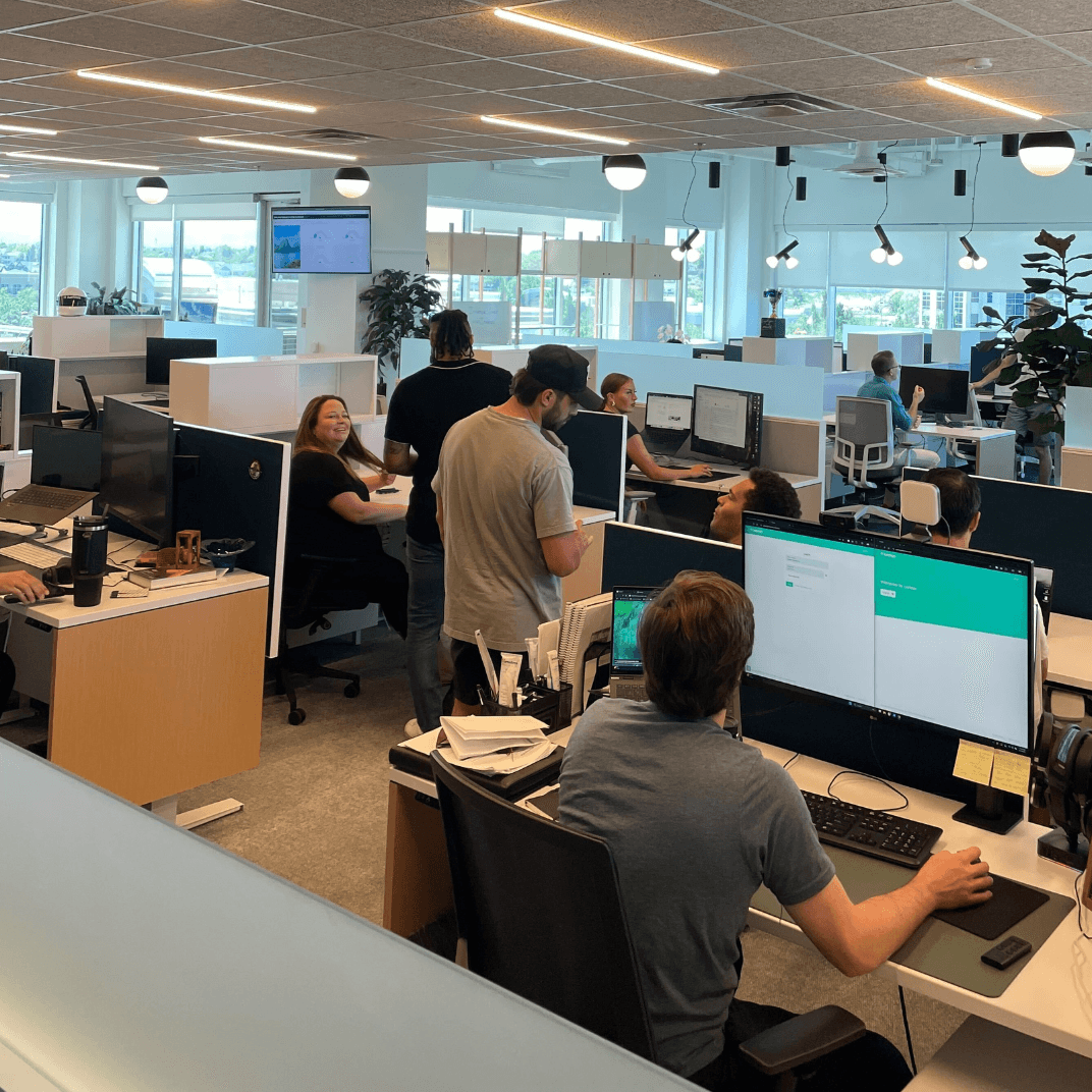 Lumion team collaborating in modern office workspace