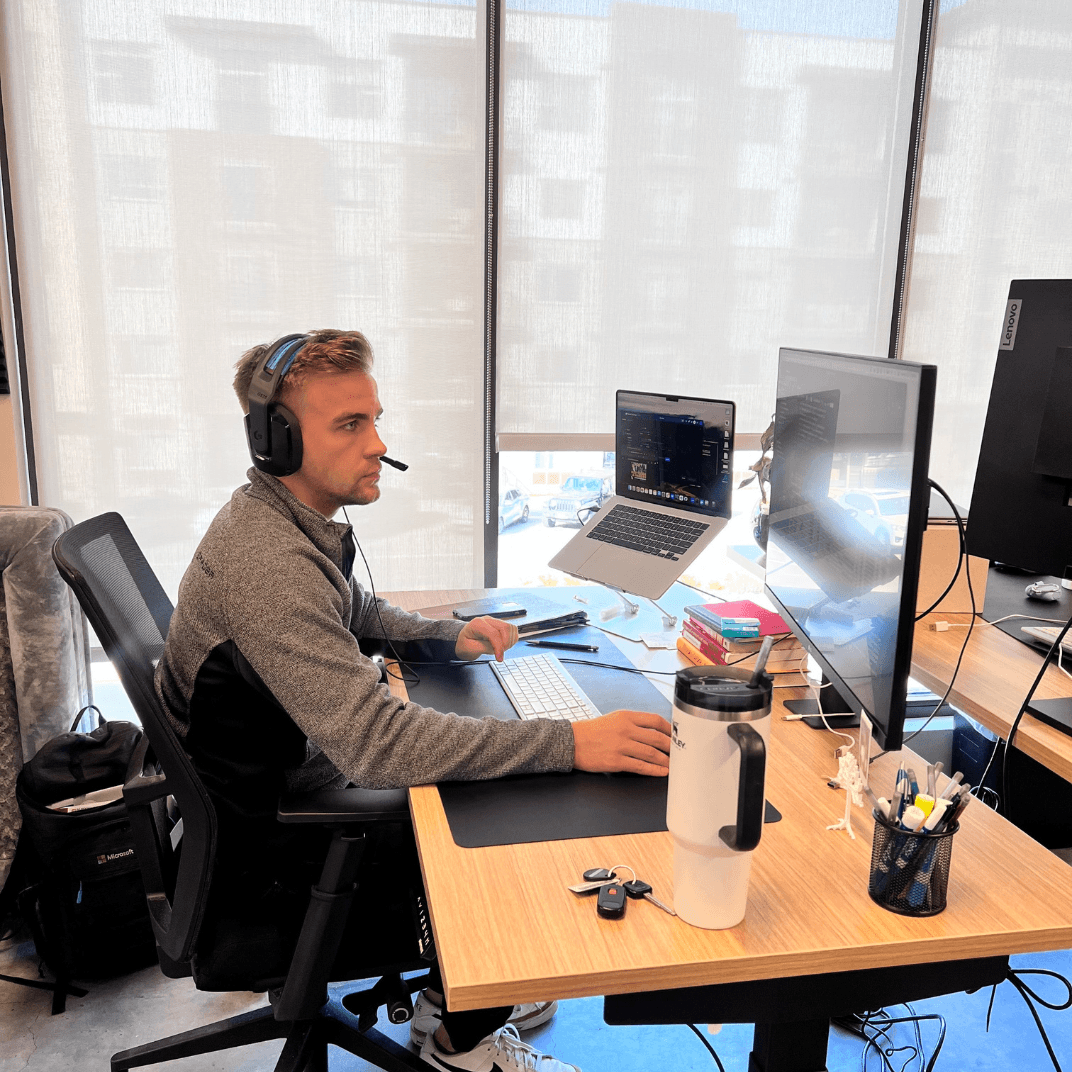 Lumion team member focused at work with headset and multiple monitors