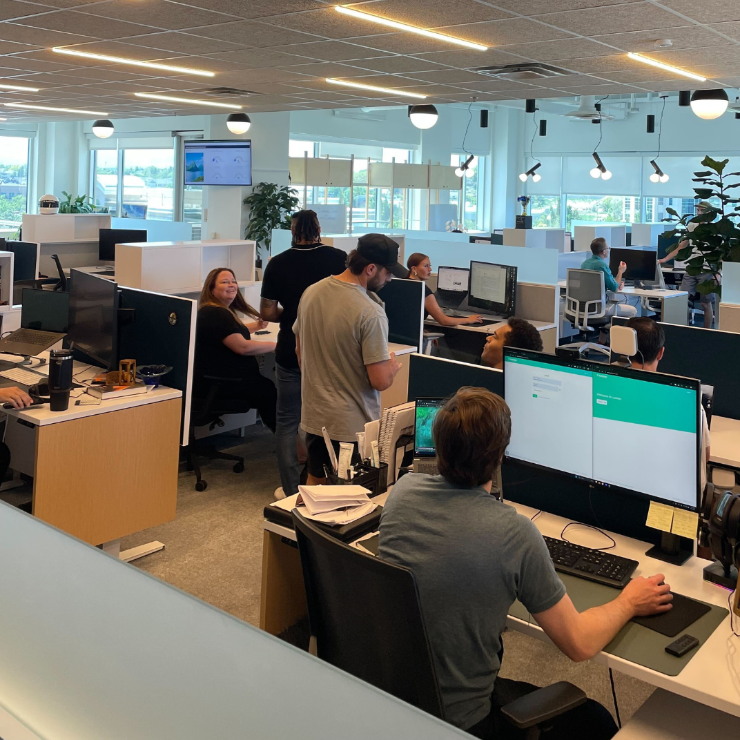 Lumion team collaborating in modern office workspace